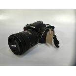 NIKON D5100 CAMERA BODY 16 MP WITH NIKON VR 18-200 MM LENS WITH CARRY CASE SOLD AS SEEN