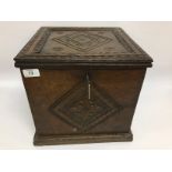 AN OAK SILVER CABINET WITH CARVED DETAIL