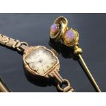 YELLOW METAL STICK PIN WITH OPAL TYPE STONES ALONG WITH A LADY'S OMS WRIST WATCH