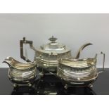 A SILVER THREE PIECE TEASET COMPRISING OF A TEAPOT LONDON 1808,