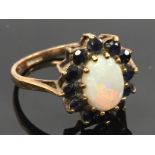 18CT GOLD OPAL RING SURROUNDED BY 12 SAPPHIRES