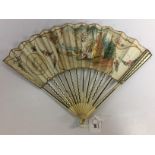 A C19TH FRENCH IVORY FAN WITH SILVER WIRE SPINES, PAINTED WITH ARCADIAN SCENE,