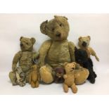 EIGHT VINTAGE STRAW FILLED TEDDY BEARS ALL VERY WELL LOVED AND SHOWING SIGNS OF STRESS