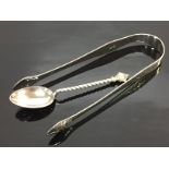 A PAIR OF EARLY 19TH CENTURY BRIGHT CUT SUGAR NIPS ALONG WITH A COFFEE SPOON,