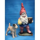 PAINTED GARDEN GNOME AND A SMALL TERRIER DOG