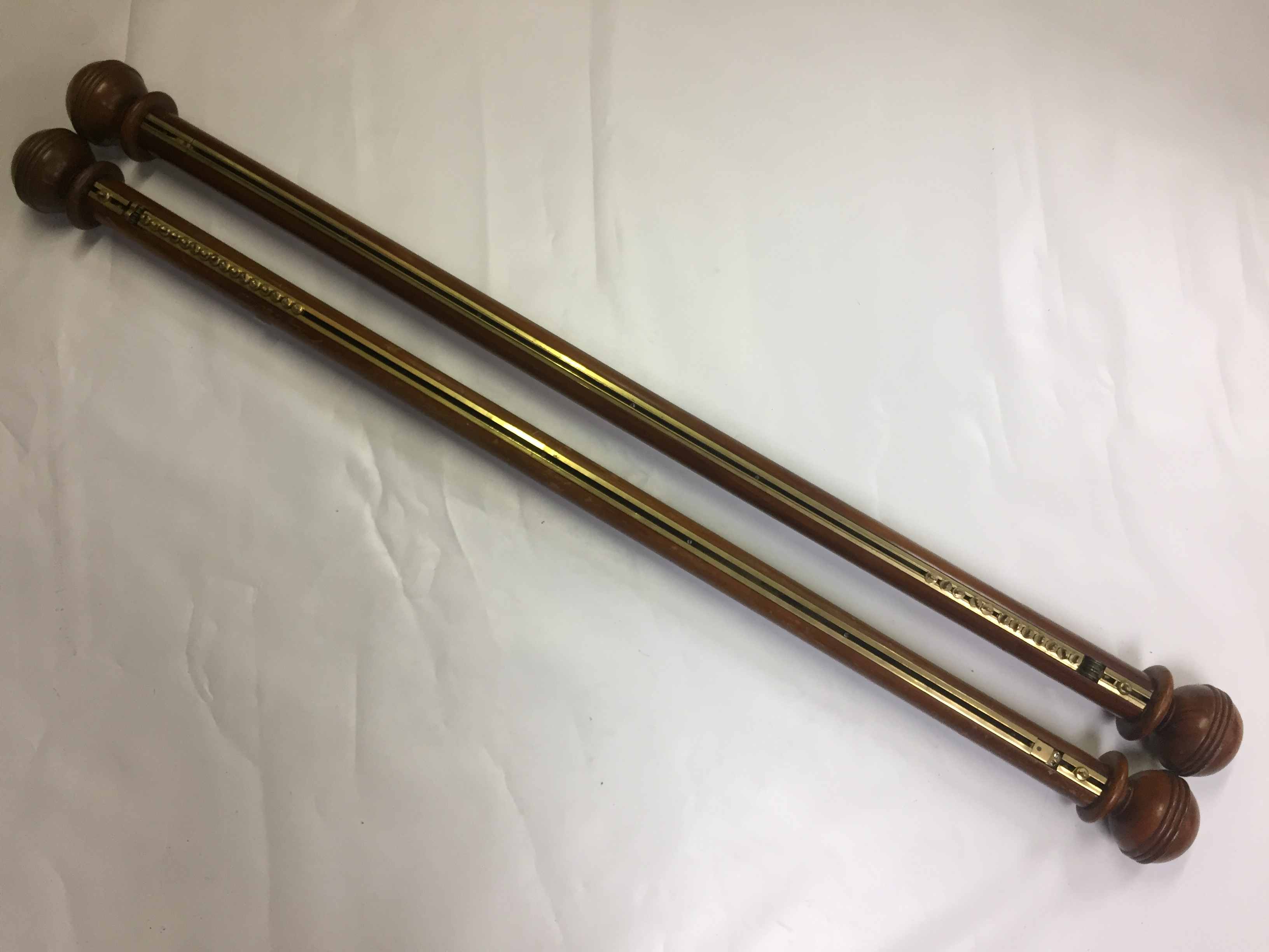 PAIR OF ANTIQUE WOODEN CURTAIN POLES WITH BRASS TRACKS