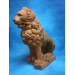 TERRACOTTA GARDEN FIGURE OF A SEATED LION 55CM