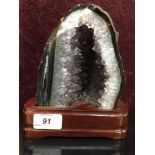 MOUNTED POLISHED AGATE SAMPLE WITH CRYSTAL CENTER