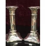 A PAIR OF SILVER 18CM GEORGIAN STYLE CANDLE STICKS SHEFFIELD ASSAY