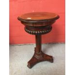 A CIRCULAR EARLY C19TH ROSEWOOD NEEDLEWORK BOX ON PEDESTAL BASE,