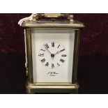 AN EARLY 20TH CENTURY BRASS CARRIAGE CLOCK, THE DIAL INSCRIBED J.W.