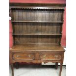 A REPRODUCTION OAK TWO DRAWER DRESSER