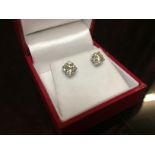 A PAIR OF DIAMOND EAR STUDS APPROX 2.