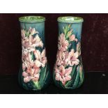 PAIR OF DOULTON LAMBETH FAIENCE VASES (RESTORED) DECORATED WITH GLADIOLI ON GREEN GROUND,