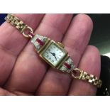 A CONTINENTAL ART DECO LADY'S GOLD WRIST WATCH,