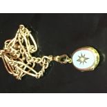 A 9CT GOLD ALBERT WATCH CHAIN SUPPORTING A YELLOW METAL AND ENAMEL LOCKET,