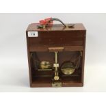 A MAHOGANY CASED INSPECTOR BRASS BEAM SCALE ENGRAVED DEVON COUNTY COUNCIL TO WEIGH 2 OZ BY DE GRAVE