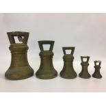 A SET OF GEORGE III LOCAL STANDARD BRONZE BELL WEIGHTS, 56, 28, 14, 2,