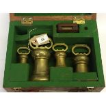 A SET OF 4 BRASS LOCAL STANDARD BELL WEIGHTS, 7, 4, 2, 1LB AVOIR ENGRAVED COUNTY OF DEVON 1859 (NO.