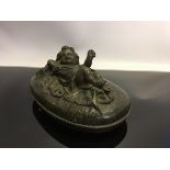 BRONZE OVAL BOX, FASHIONED AS BABY ON PILLOW 16CM LONG,