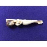 19TH CENTURY IVORY RECLINING NUDE NETSUKI BEARING SIGNATURE