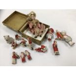 SMALL CHINA DOLL IN EARLY CLOTHING 13CM + A COLLECTION OF APPROX 12 CHINA CHRISTMAS & OTHER CAKE