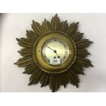 GILT WOOD STARBURST WALL CLOCK RETAILED BY PEARCE & SONS LTD LEICESTER