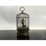 A BRASS BIRD CAGE CLOCK