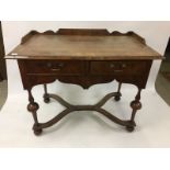 A 19TH CENTURY TWO DRAWER WALNUT DESK