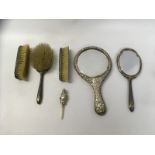 4 PIECE ENAMELLED SILVER BACKED BRUSH SET ALONG WITH SILVER BACKED HAND MIRROR + POLICEMAN RATTLE