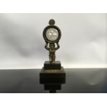 BRONZE POCKET WATCH STAND, ON A KNEELING CHERUB,