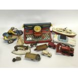 COLLECTION OF TIN PLATE TOYS - 'METTYPE JUNIOR' TYPEWRITER, CLOCKWORK BOAT, MOTOR CYCLE + SIDE CAR,