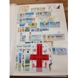 BOX WITH VARIOUS IN THREE STOCKBOOKS AND A FOLDER, HONG KONG, VIRGIN ISLANDS ETC.