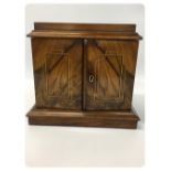 VICTORIAN WALNUT TWO DRAWER MINIATURE CHEST WITH OPENING FRONT DOORS DECORATED WITH BOXWOOD AND