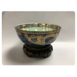 WEDGWOOD LUSTRE DRAGON DESIGN BOWL PRESENT ON A CARVED HARDWOOD STAND 26CM. DIA.