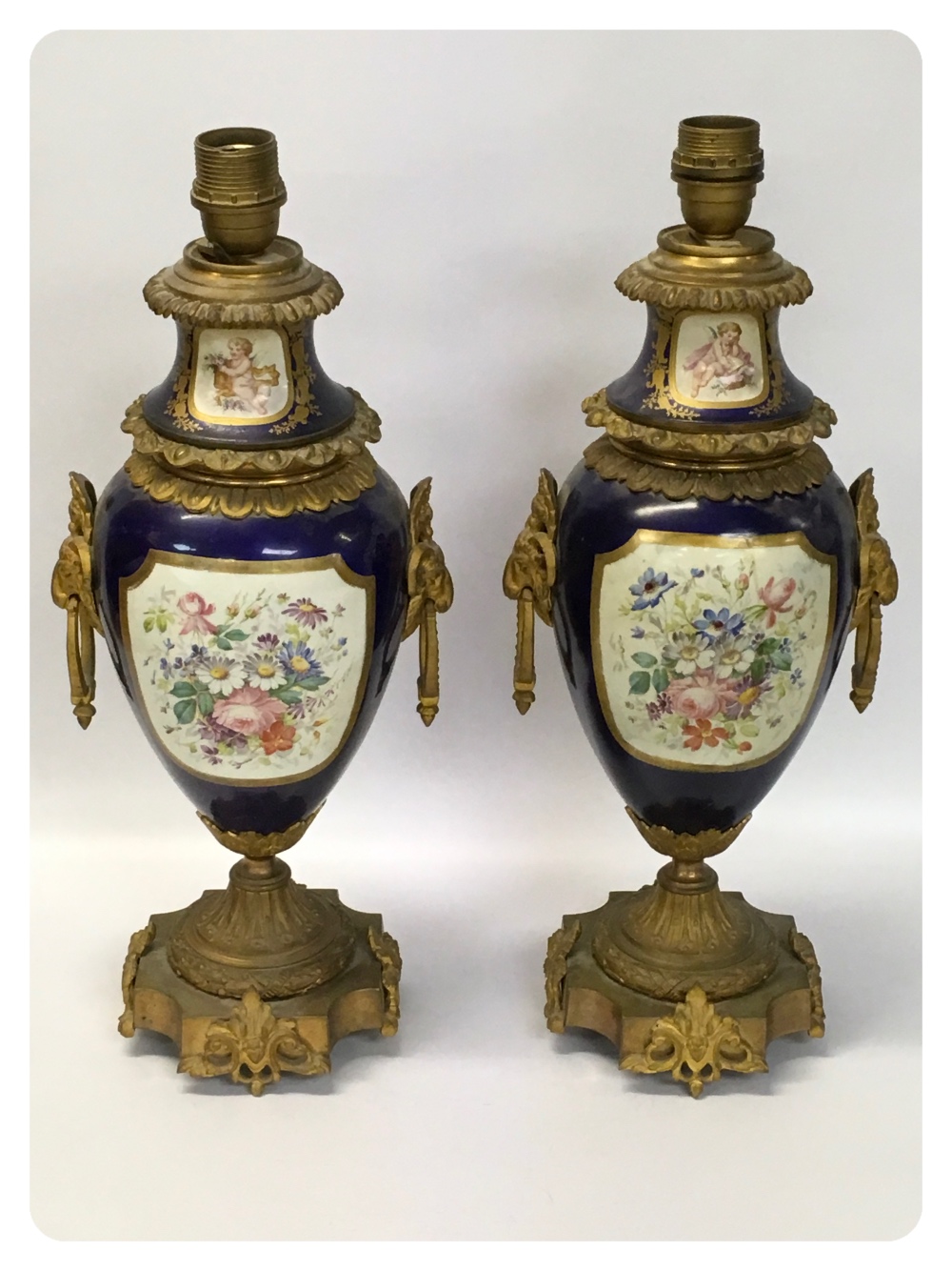 A PAIR OF FRENCH SEVRES STYLE AND GILT METAL MOUNTED TABLE LAMPS (ONE DAMAGED AND REPAIRED)