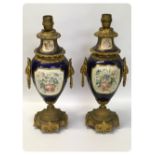 A PAIR OF FRENCH SEVRES STYLE AND GILT METAL MOUNTED TABLE LAMPS (ONE DAMAGED AND REPAIRED)