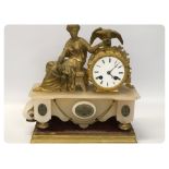 A FRENCH GILT METAL AND HARDSTONE MANTEL CLOCK IN THE FORM OF A SEATED CLASSICAL LADY WITH AN EAGLE