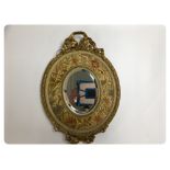 ANTIQUE GILT FRAMED OVAL MIRROR WITH EMBROIDERED BORDER A/F