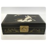 JEWELLERY BOX FINISHED IN BLACK LACQUER WITH MOTHER OF PEARL AND ABALONE SHELL INSET DESIGN TO TOP