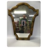 A C19TH FRENCH GILT FRAMED WALL MIRROR OF SHAPED REED AND SHELL DESIGN,