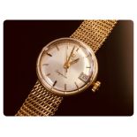 OMEGA 9CT. GOLD LADYMATIC WRIST WATCH ON 9CT. GOLD BRACELET APPROX. 26GM.