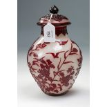 A Chinese Peking cased and carved baluster vase and cover, the ruby glass overlay carved with