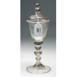 A probably mid 18th century Dutch wheel etched glass pedestal goblet and cover, the conical bowl