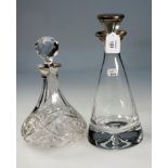 A millennium edition conical glass decanter, with silver capped stopper and collar, by W I