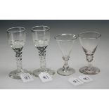 A pair of late 18th century cut stemmed wine glasses, with floral wheel etching over a rough