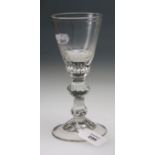 A possibly late 17th/early 18th century Bohemian glass pedestal goblet, with small printy etched