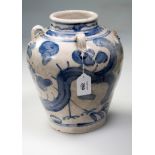 A Chinese swatow blue and white pottery vase, with lug handles, painted with stick leg dragons,