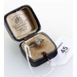 A single stone diamond ring, the cushion cut diamond in claw mount, with three stone diamond