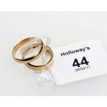 An Irish 18ct gold wedding band, together with another Irish 18ct gold wedding band